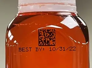 Axian-IQ sample mark on orange plastic bottle