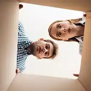 Man and woman looking into empty box.