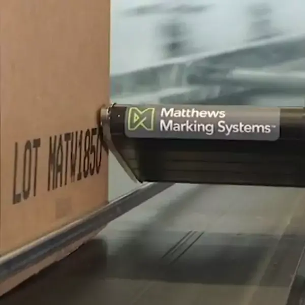 V series Matthews Marking System Printhead marking on corrugate carboard. It's making large character carton shipping marks.