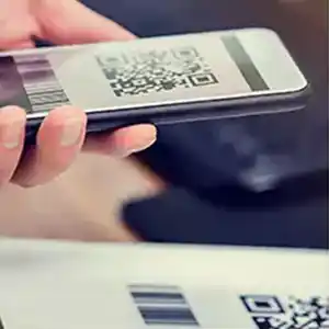 Cell phone scanning a barcode on paper