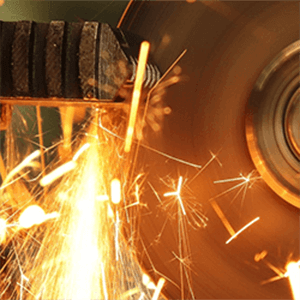 Metal grinding with sparks flying.