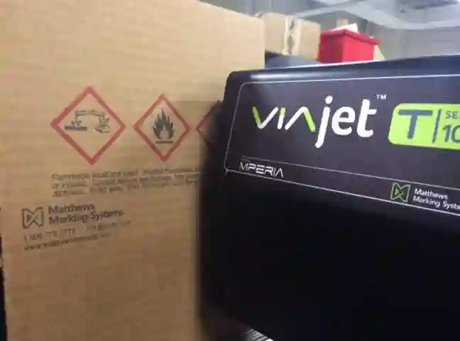 Regulatory and warning graphics printed on corrugated cardboard carton by a Matthews Marking System VAIjet