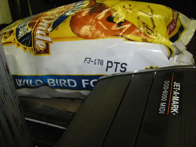 drop-on-demand inkjet marking system printing mark and code on plastic bird feed bird seed bag