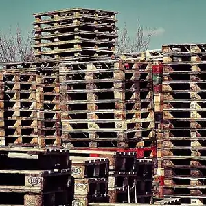 large pile of wooden pallets