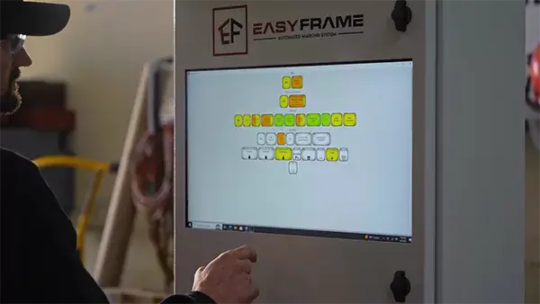 Production worker using Easyframe software. 
