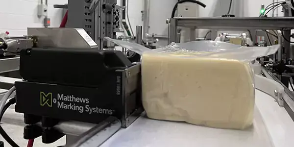 Matthews L12 printing on a block of cheese
