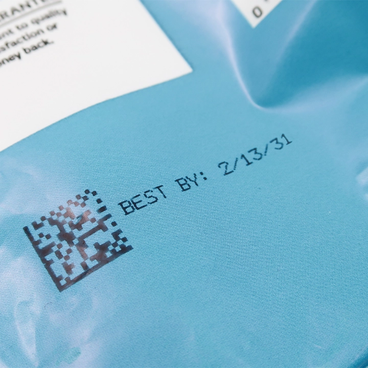 2D barcode and best-by date printed on flexible film packaging for product identification and traceability.