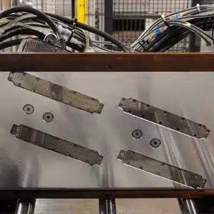 Close-up of four V-Series drop-on-demand inkjet printheads mounted together for synchronized inline box marking at ROMA.
