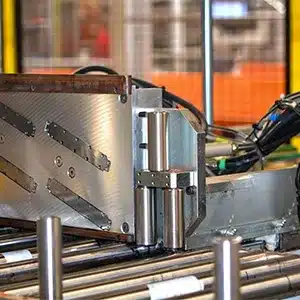 Four V-Series drop-on-demand inkjet printheads mounted above a conveyor for synchronized inline box marking at ROMA.