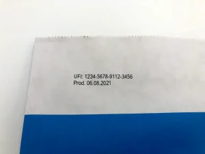 Paper bag printed with a UFI code and production date.
