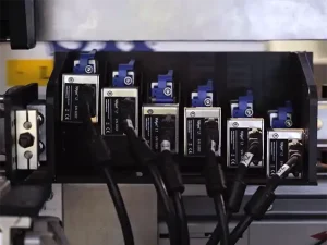 Six Matthews L1 thermal inkjet printheads stitched together on a production line.
