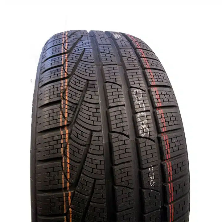 Industrial tire with high-contrast ink markings on the tread for automotive manufacturing identification and traceability.