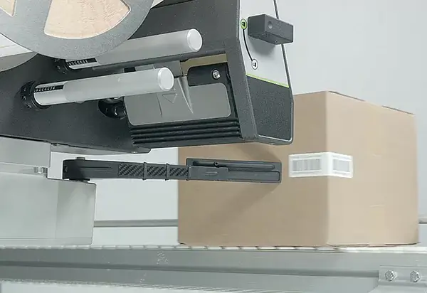 A-Series applying a label to the side of a corrugated carton