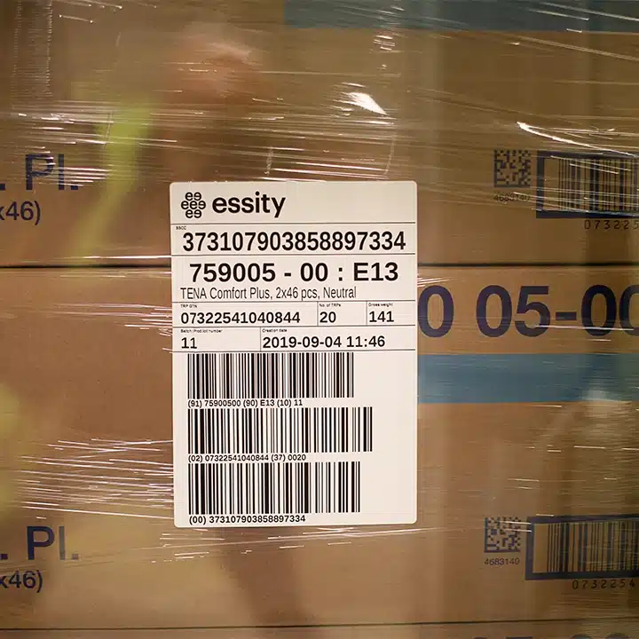 Shipping case with barcode label and 2D code printed for warehouse and logistics tracking.