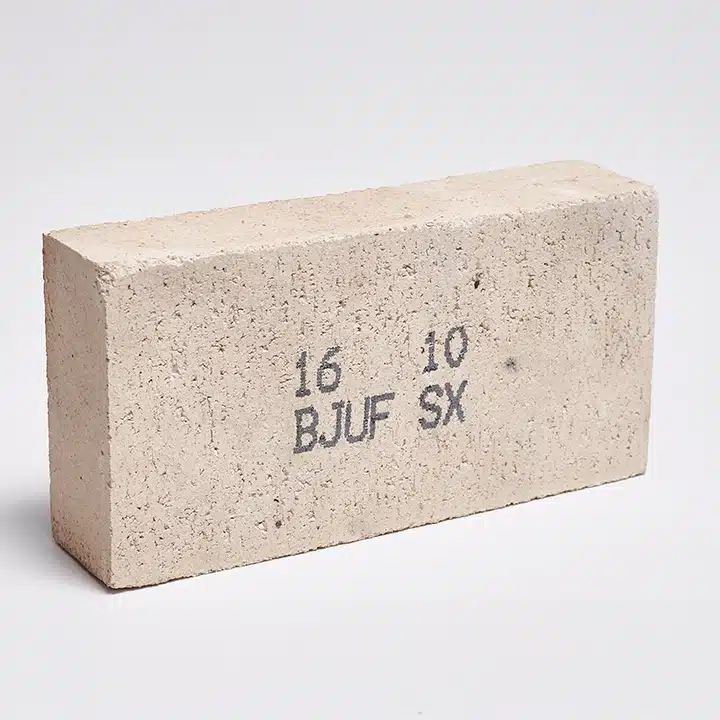 Identification code printed on a concrete brick for manufacturing and inventory tracking.