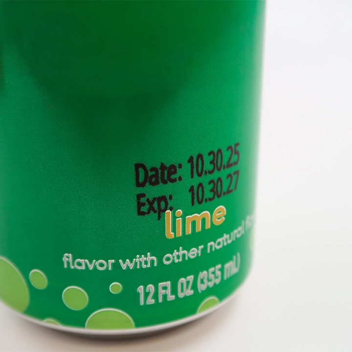 Date and expiration code laser marked on an aluminum beverage can for product traceability.