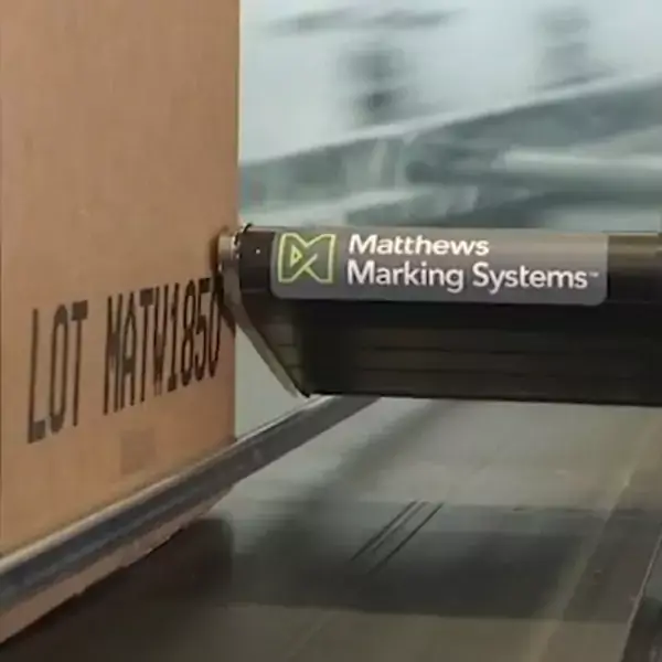 V-Series drop-on-demand printer from Matthews Marking Systems printing large characters on a product carton.