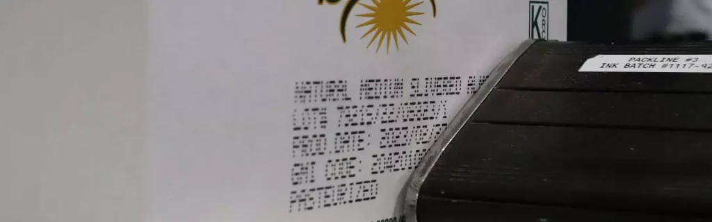V-Series valvejet printer marking production codes onto a SunnyGem almonds carton.