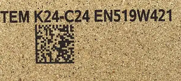 2D code and alphanumeric text printed on chipboard