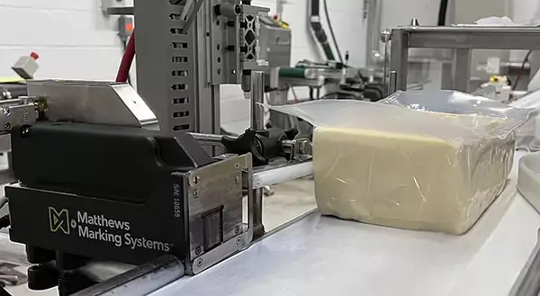 Matthews L-12 printing on a block of Fairview Swiss cheese