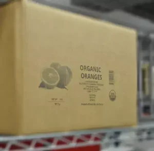 Organic oranges carton with printed product and barcode information