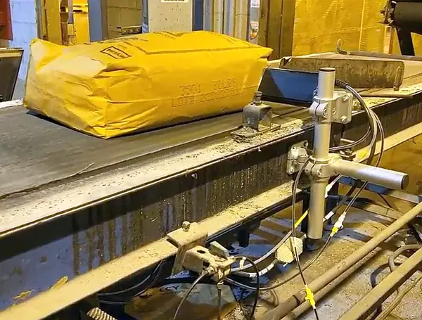 Production code printed on yellow industrial bag