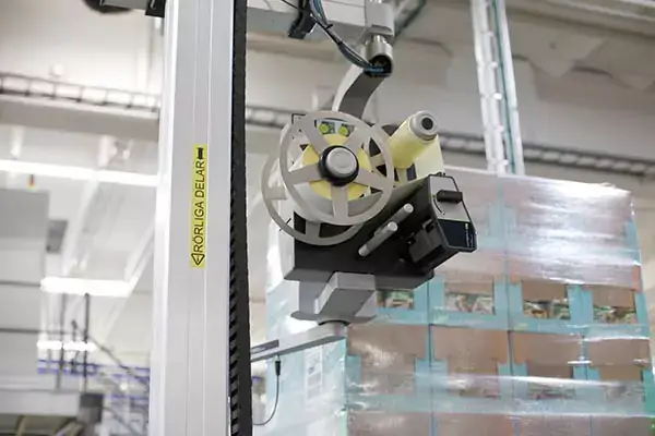 A-Series automated pallet labeler in Estrella plant labeling wrapped pallet.