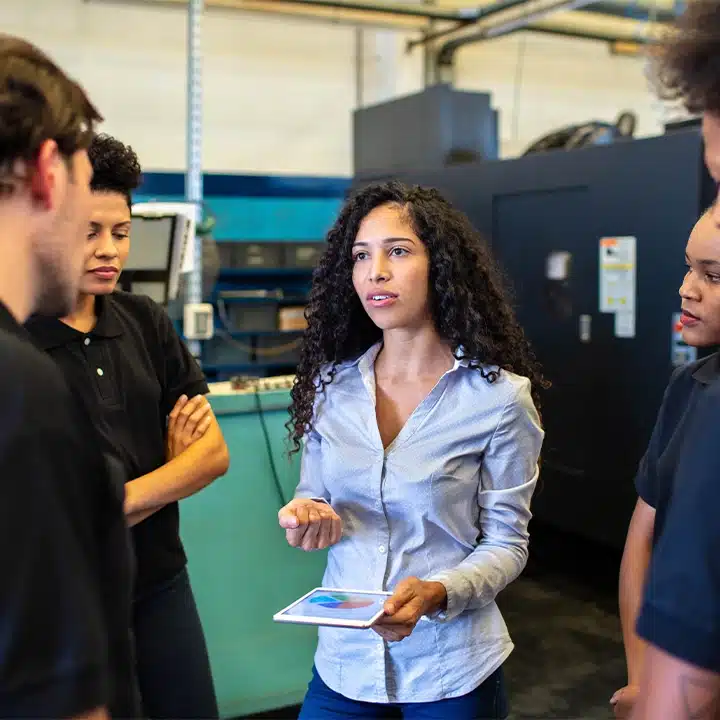 woman explaining to her team