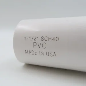 Fiber laser marking on a white PVC pipe fitting with product specifications and country of origin.