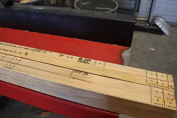 Marks on 2x4 lumber showing RJP Framing.
