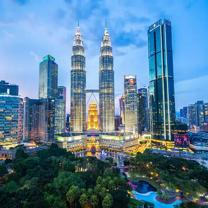 Kuala Lumpur skyline with tall buildings.
