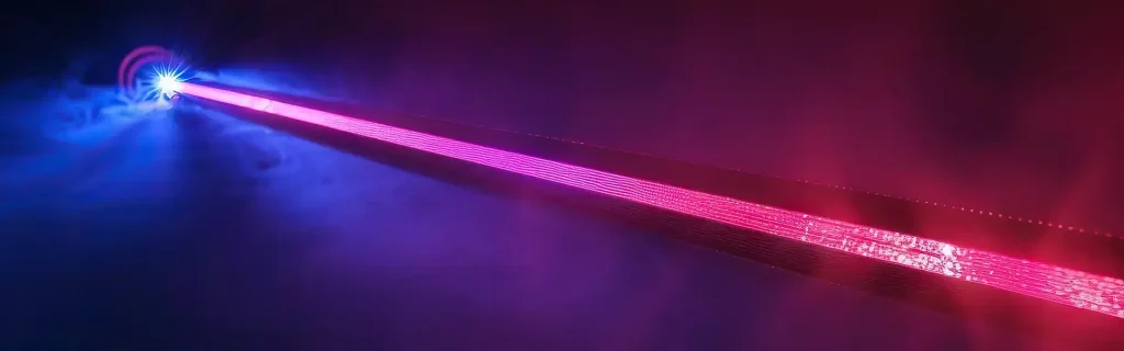 Bright red laser beam extending across a dark background with blue and purple lighting, representing industrial laser marking technology.
