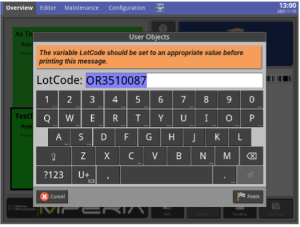 MPERIA controller displaying an operator prompt to enter a lot code before printing, with an on-screen keyboard and highlighted code field.